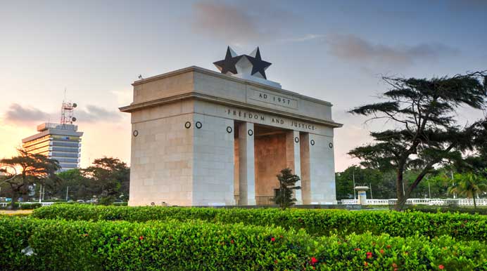 The Independence Arch in Black Star Square Accra Ghana with Freedom and Justice inscription at sunset.